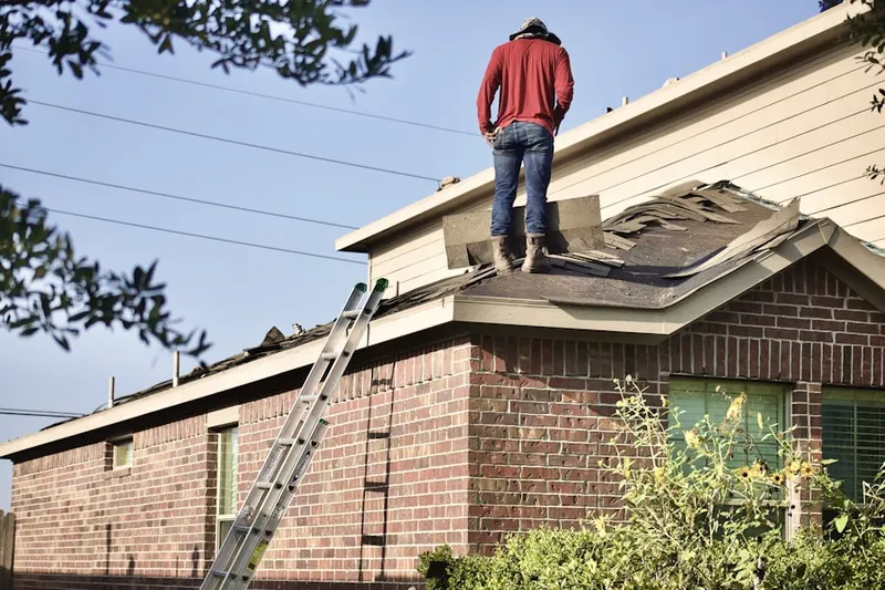 Professional roofer working on a residential roof in Lathrop